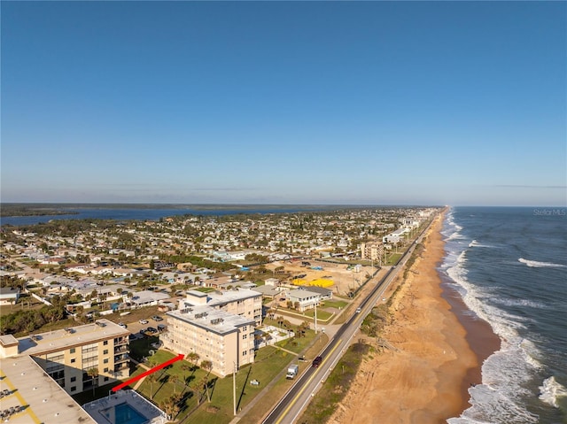 bird's eye view with a beach view and a water view