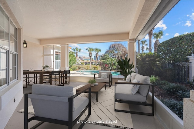 view of patio / terrace with a fenced in pool and an outdoor hangout area