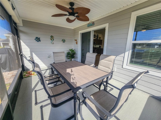 sunroom featuring ceiling fan