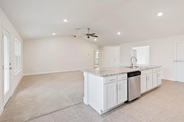 kitchen with light colored carpet, sink, dishwasher, white cabinetry, and lofted ceiling