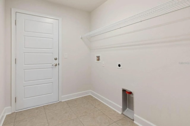 laundry area featuring washer hookup, electric dryer hookup, and light tile patterned flooring