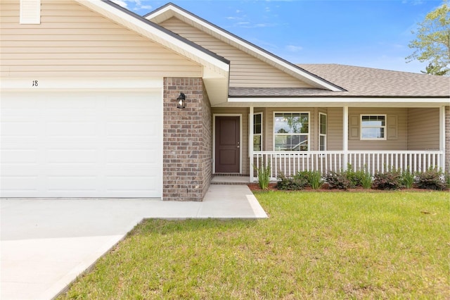 view of front facade with a front yard and a garage