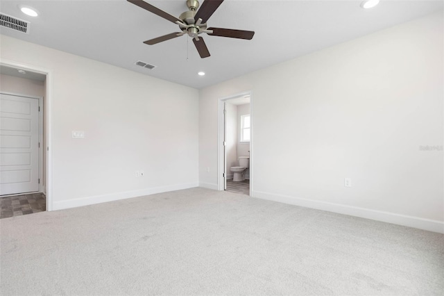 carpeted empty room featuring ceiling fan