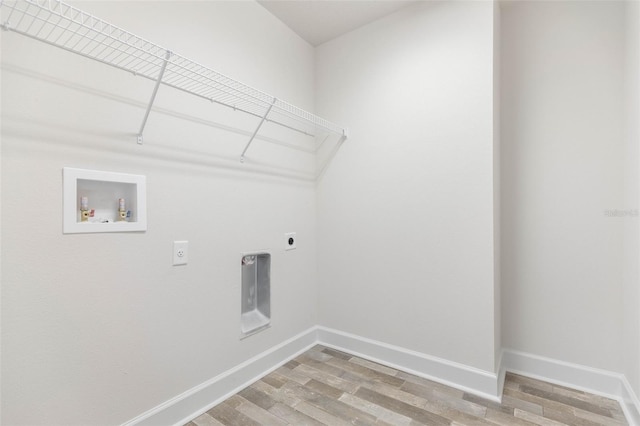 washroom with washer hookup, hardwood / wood-style flooring, and electric dryer hookup