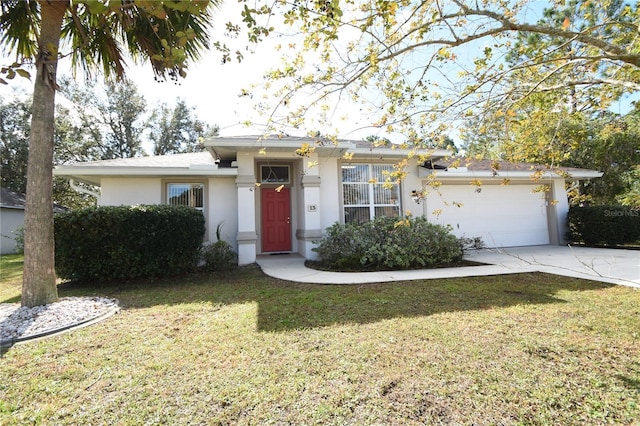 view of front of house with a garage and a front yard