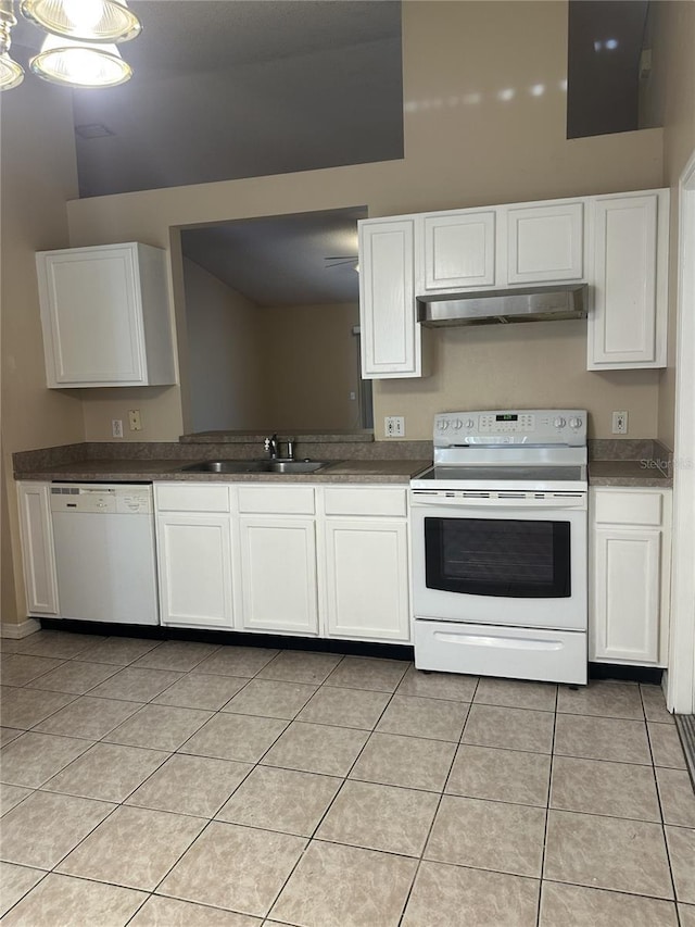 kitchen with white cabinets, white appliances, sink, and light tile patterned flooring