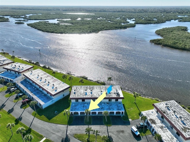 birds eye view of property featuring a water view