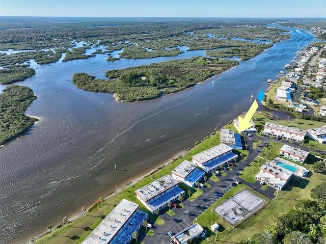 birds eye view of property featuring a water view