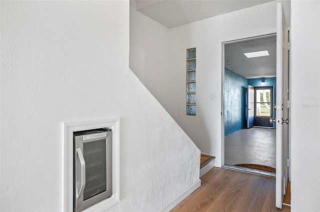 stairs with hardwood / wood-style flooring