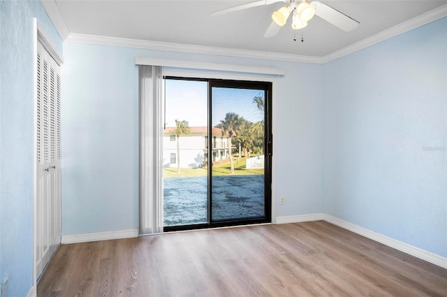 doorway with ceiling fan, crown molding, and light hardwood / wood-style flooring