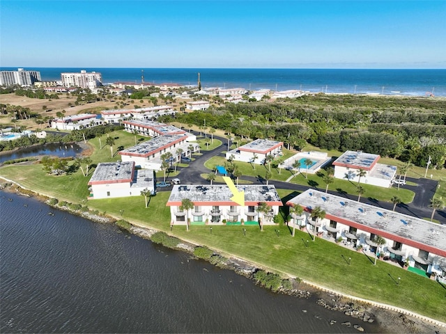 birds eye view of property featuring a water view