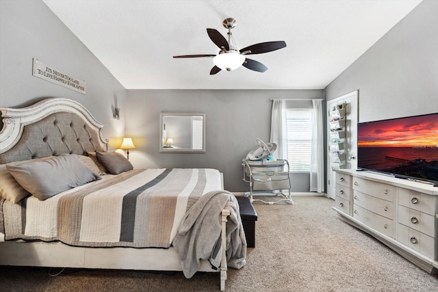 carpeted bedroom featuring ceiling fan and lofted ceiling