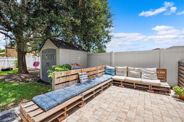 view of patio featuring a storage shed