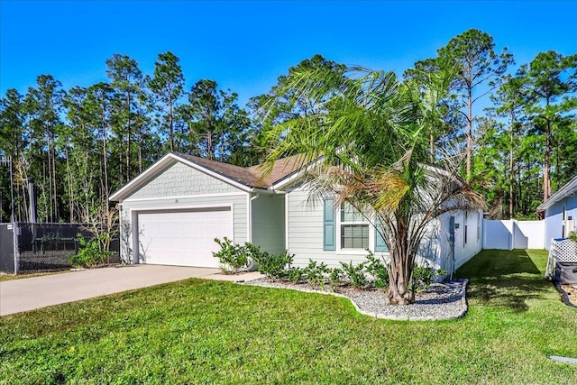 view of front of property featuring a garage and a front yard