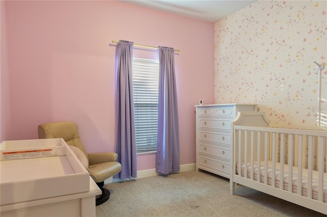 carpeted bedroom with a crib