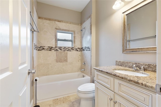 full bathroom with vanity, toilet, and tiled shower / bath combo