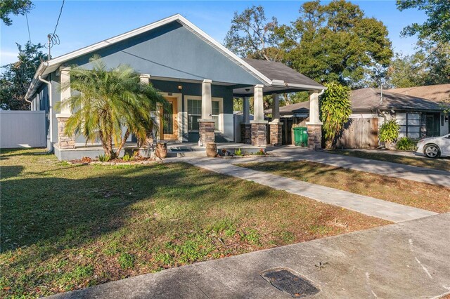 view of front of home featuring a porch and a front yard