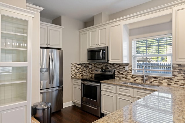 kitchen with sink, white cabinets, and stainless steel appliances