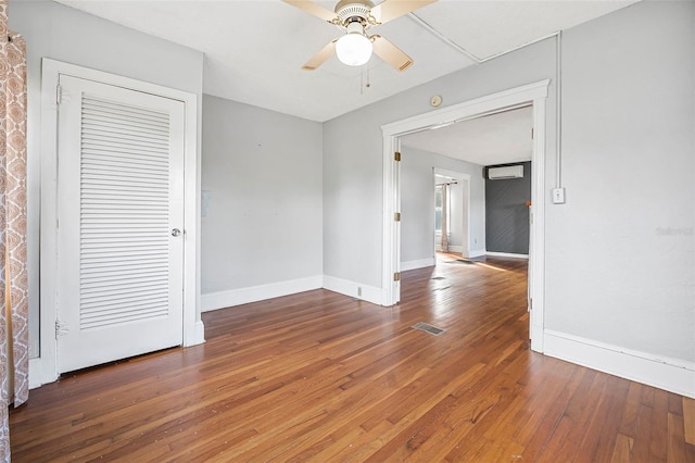 spare room with ceiling fan and dark hardwood / wood-style flooring