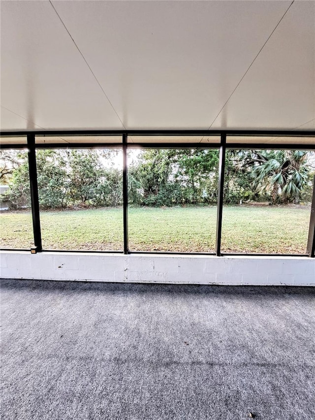 unfurnished sunroom featuring a wealth of natural light