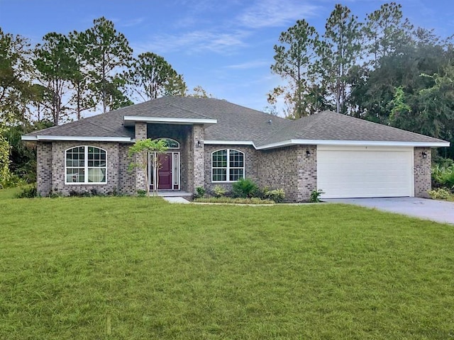 ranch-style home featuring a garage and a front yard