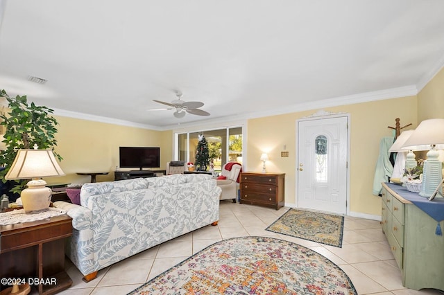 living room featuring crown molding, light tile patterned floors, and ceiling fan