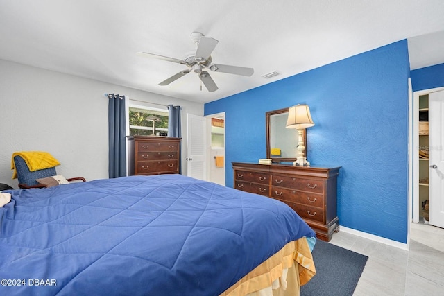 bedroom featuring ceiling fan and light tile patterned flooring