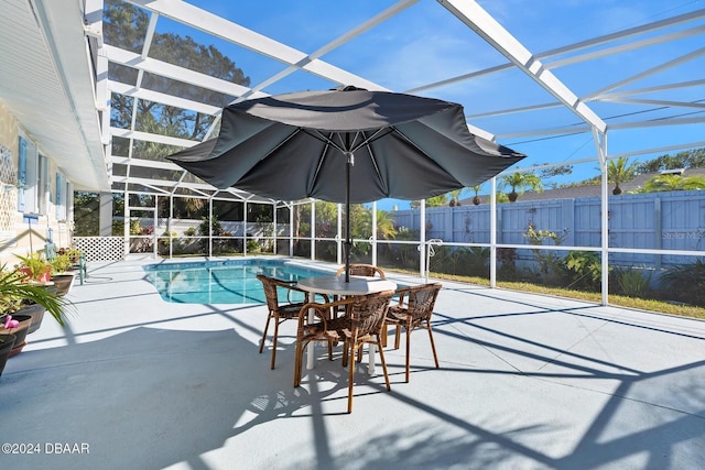 view of pool featuring a lanai and a patio