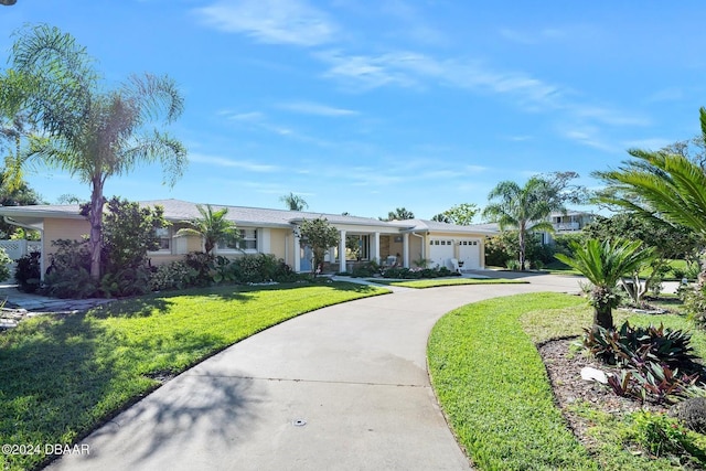 single story home with a front lawn and a garage