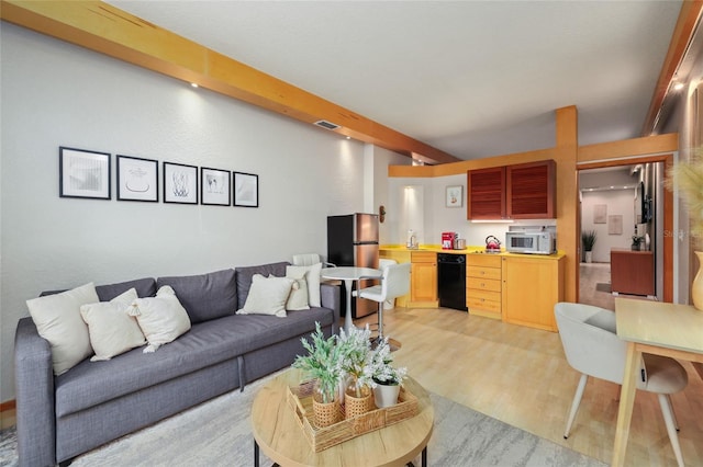 living room with sink and light hardwood / wood-style floors