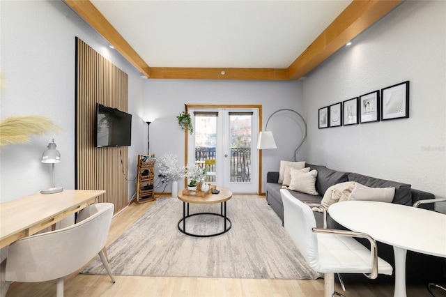 living room featuring light hardwood / wood-style flooring and french doors