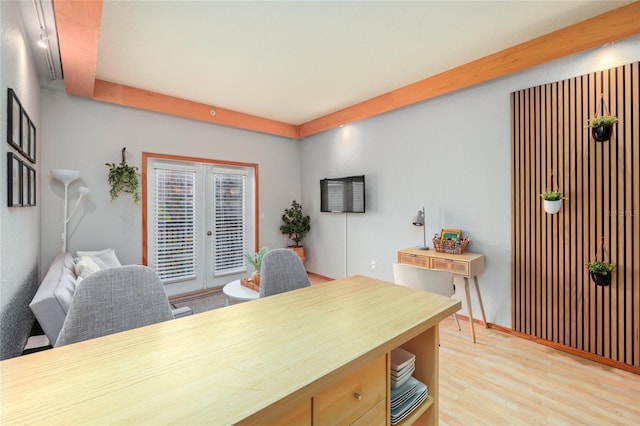 office space with light hardwood / wood-style flooring and french doors