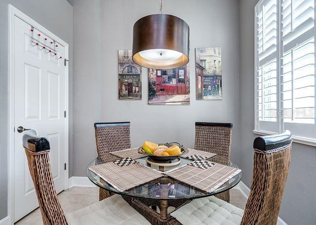 dining space with light tile patterned flooring