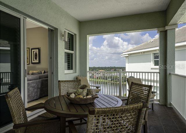 balcony featuring a water view