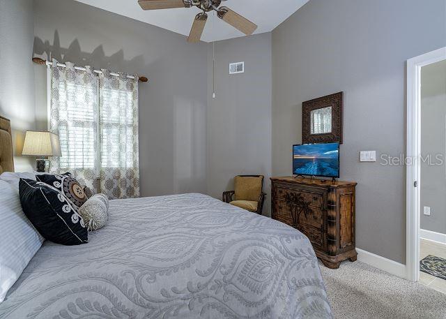 bedroom featuring carpet flooring and ceiling fan