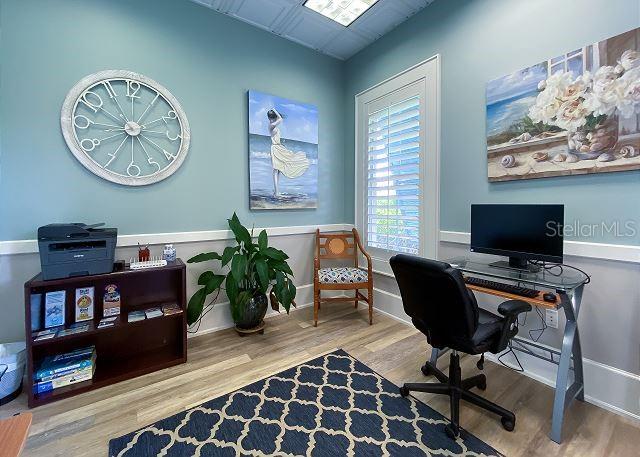 office space with wood-type flooring