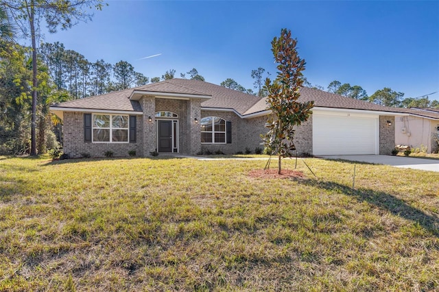 ranch-style house featuring a front lawn and a garage