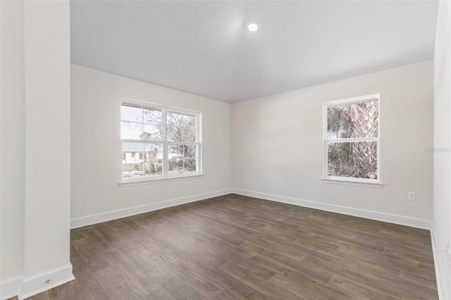 empty room featuring dark wood-type flooring