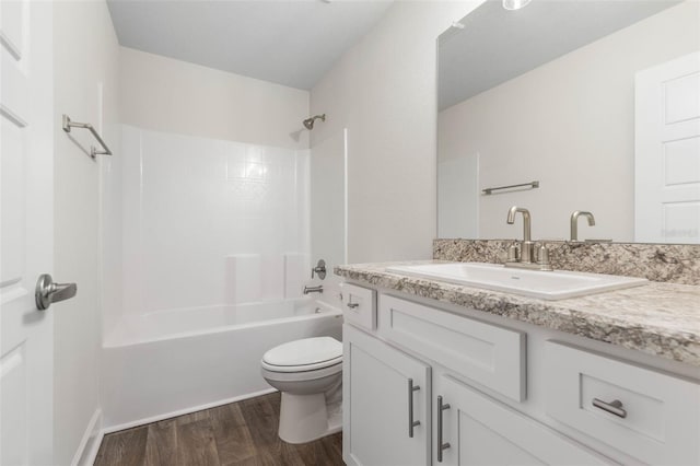 full bathroom with toilet, bathtub / shower combination, wood-type flooring, and vanity