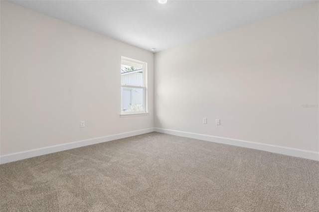 unfurnished room with carpet floors