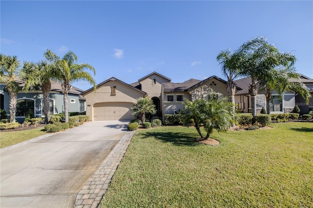 view of front of home with a garage and a front yard