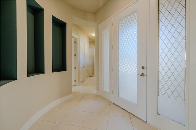 hallway with light tile patterned flooring