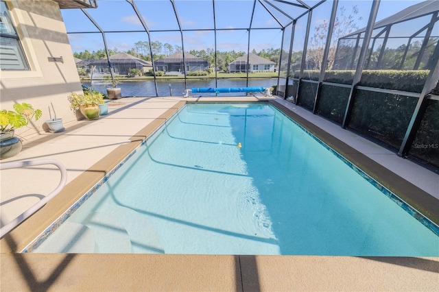 view of pool with a water view, a patio area, and a lanai