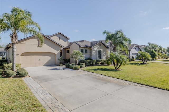 view of front of home featuring a front yard and a garage