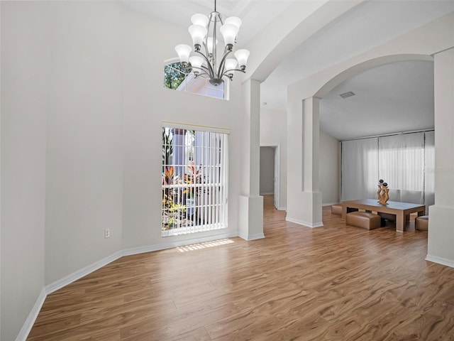 living room featuring hardwood / wood-style floors and a chandelier