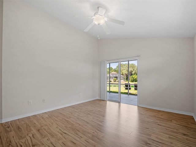 spare room with ceiling fan, high vaulted ceiling, and light wood-type flooring