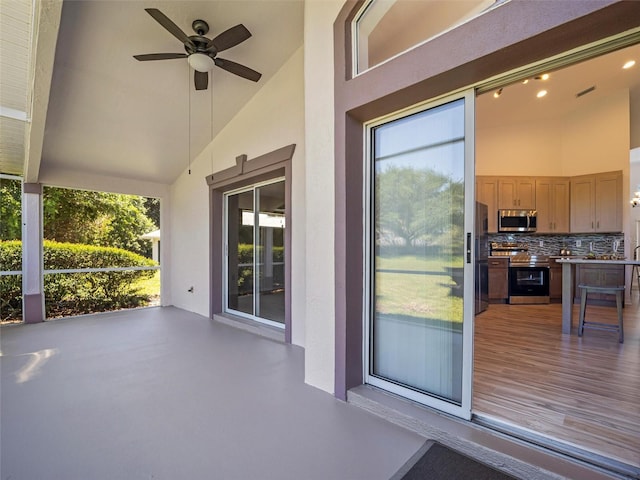 view of patio featuring ceiling fan