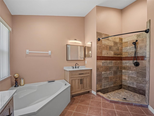 bathroom with tile patterned floors, plus walk in shower, and vanity