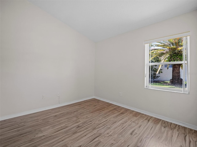 spare room with light hardwood / wood-style flooring