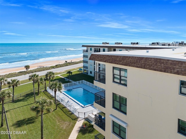 exterior space with a beach view and a water view